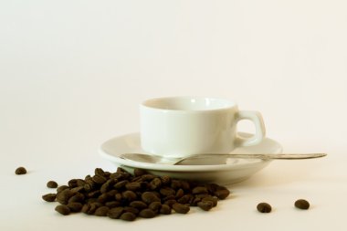 A white coffee cup and saucer