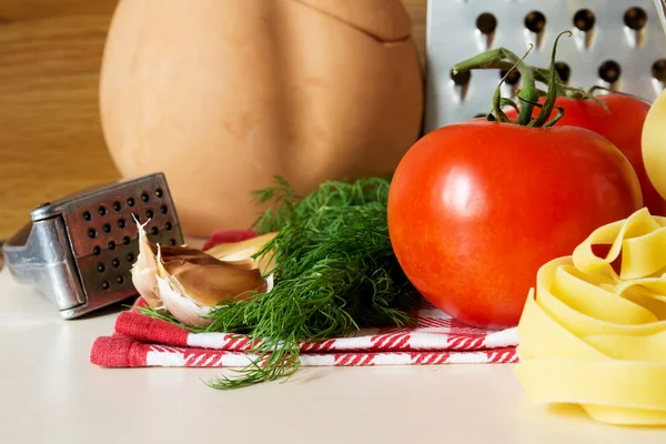 Ingredients for cooking pasta with tomatoes and herbs — Stock Photo, Image