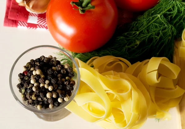 Ingredients for cooking pasta with tomatoes and herbs — Stock Photo, Image