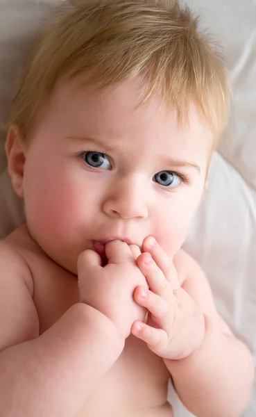 A little girl sucking her fingers — Stock Photo, Image