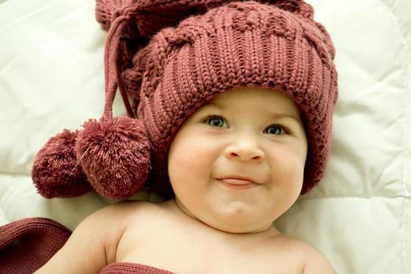 stock image Little girl in the lilac hat and scarf