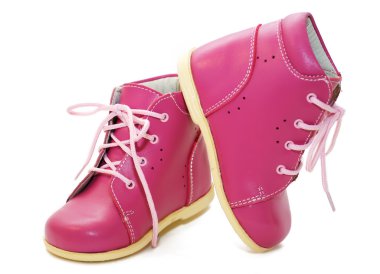 Pink baby shoes on a white background clipart