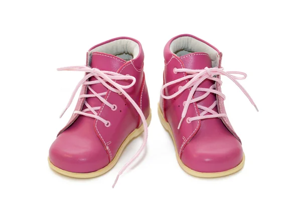 Rózsaszín baba cipő fehér alapon — Stock Fotó