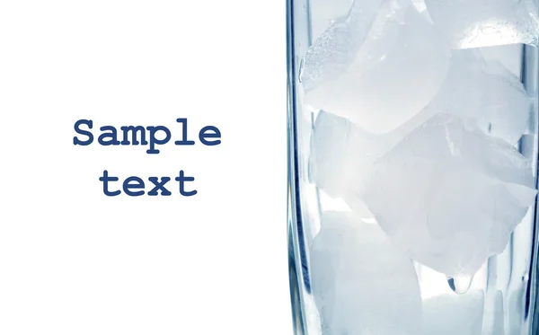 Copa de cristal con hielo sobre fondo azul —  Fotos de Stock