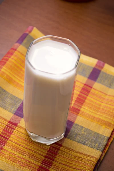 Glass of milk on wooden table — Stock Photo, Image