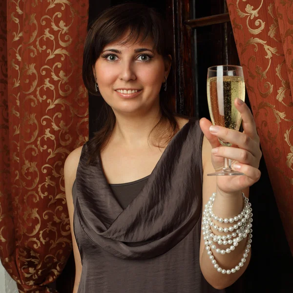 Woman with glass of champagne - Cheers