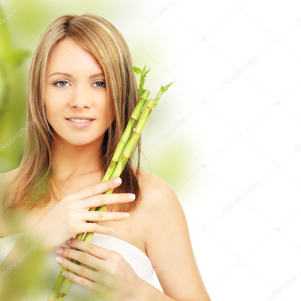 Spa woman with bamboo. Clear fresh skin