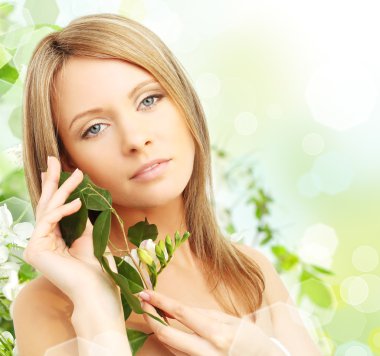 Beautiful young woman with spring blossom clipart