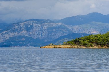 Islands with hills and mountains view from water. Fethyie, Turkey