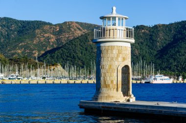 Old colorful lighthouse at Marmaris city embankment clipart