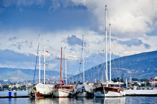 stock image Group of big sailing vessels moored. Perfect mountain landscape