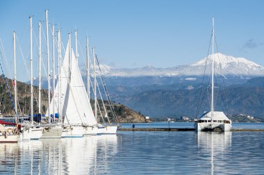 Sailing yachts and catamaran in the marina. Mediterranean sea. clipart