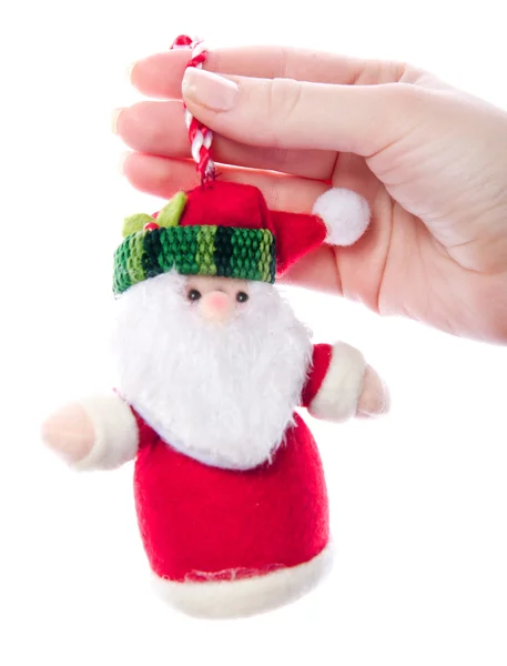 Santa brinquedo na mão das mulheres — Fotografia de Stock