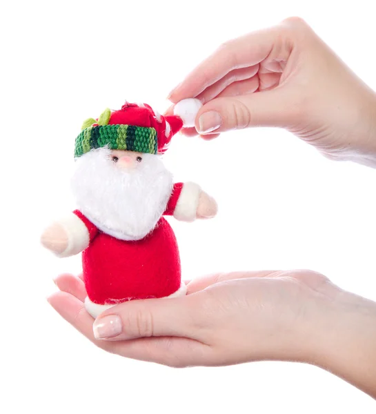 Santa brinquedo na mão das mulheres — Fotografia de Stock