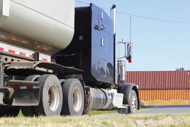 Large truck stopped at train crossing clipart