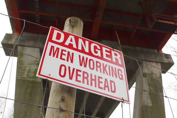Άνδρες εργάζονται ΓΒΕ σημάδι — Φωτογραφία Αρχείου