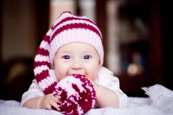 Cute 6 month baby holding a bobble in her hands — Stock Photo, Image