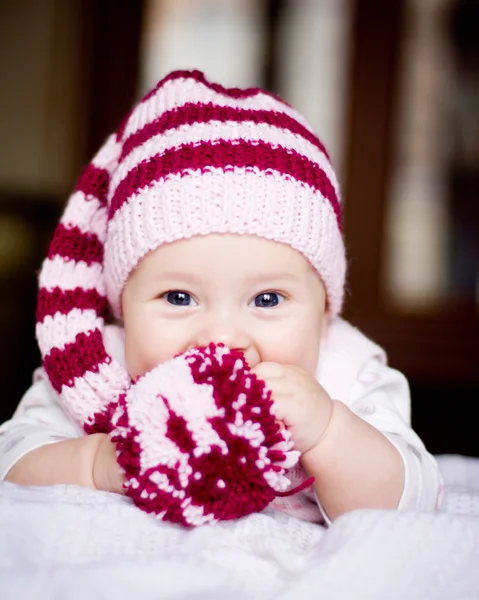 Cute baby in a hat with pompom — Stock Photo, Image