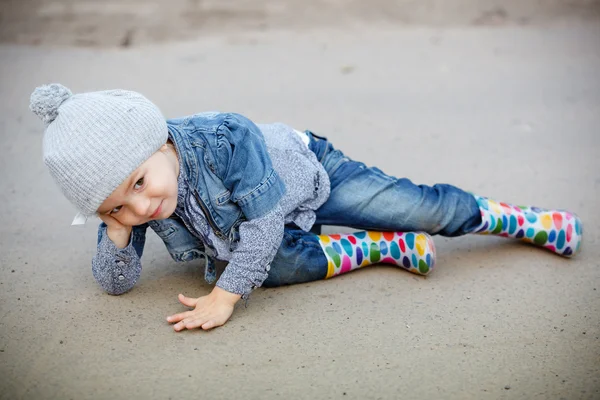 Beautiful Little girl in blue jeans outdoor — Stock Photo, Image