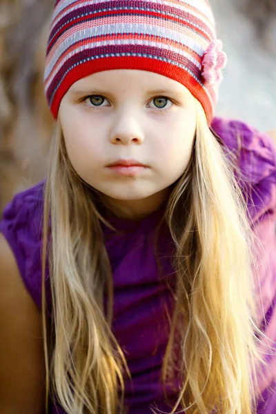 Portrait of a little girl who poses like a model of adult — Stock Photo, Image