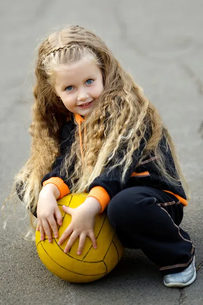 Portrait of a young girl with soccer ball — Stock Photo, Image