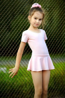 Portrait of a young girl in a gym suit clipart