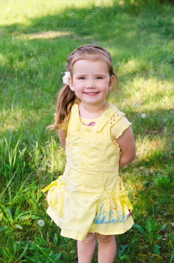 Portrait of smiling little girl in dress outdoor — Stock Photo ...