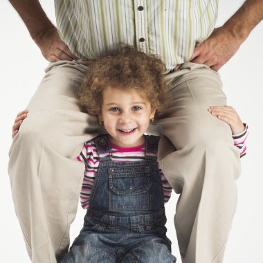 Happy toddler girl holding father on shoulders clipart