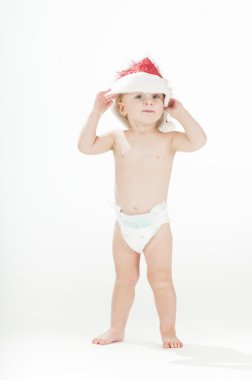 Cute baby toddler girl wearing santa's hat and diapers clipart