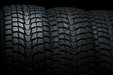 Close up detail of three winter tires clipart