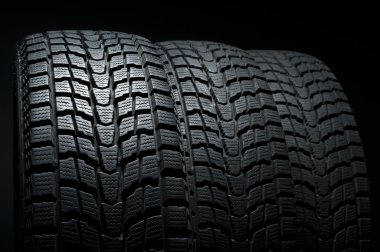 Close up of three winter tires clipart