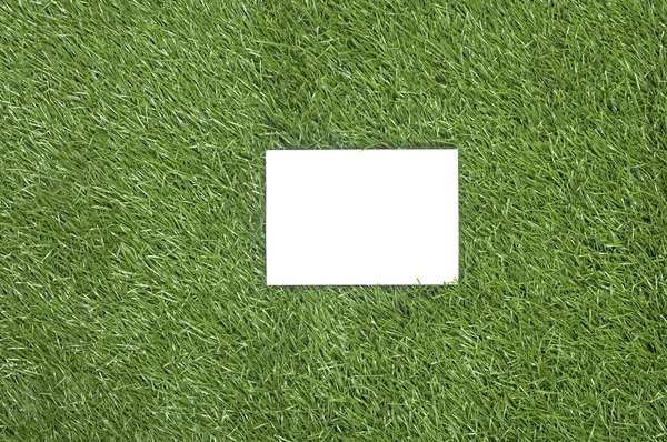 White Paper On The Grass — Stock Photo, Image