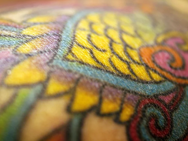 Närbild av tatuering Stockbild