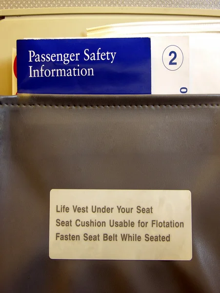 航空会社座席ポケット情報 ロイヤリティフリーのストック写真