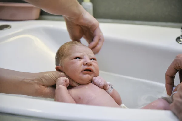 Newborn Baby - First Bath Stock Photo
