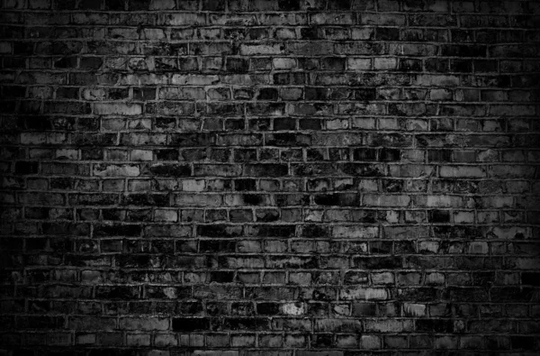 Tmavá cihelná zeď textura nebo pozadí — Stock fotografie