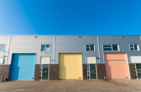 Business units for small companies with colorful roller doors