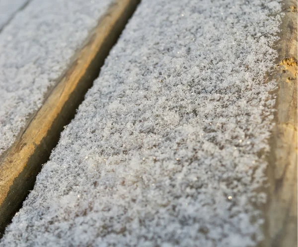 Nieve en la superficie de madera. antecedentes —  Fotos de Stock