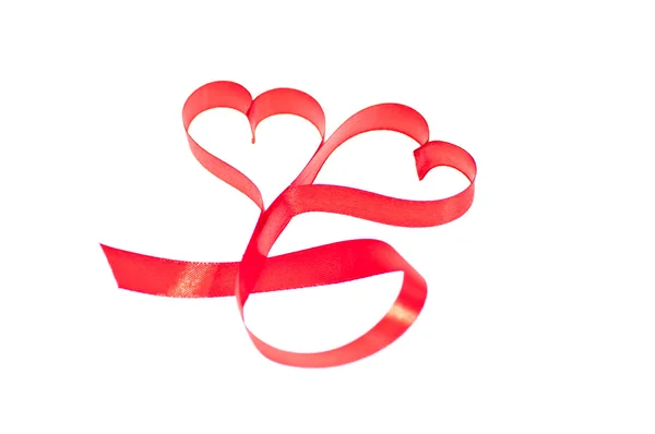 Double heart shaped red ribbon close up — Stock Photo, Image