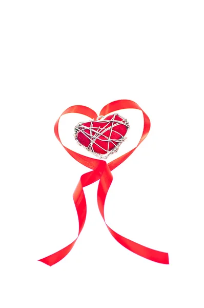 Heart shaped red ribbon with metal wire heart — Stock Photo, Image