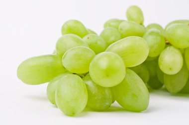 Fresh grapes closeup on bright background