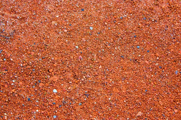 Textura real de pequenas pedras vermelhas como fundo vermelho para projetar — Fotografia de Stock