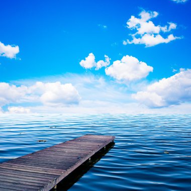 Wooden jar, pier on an ocean in summer view of sunny day, blue sky and whit clipart