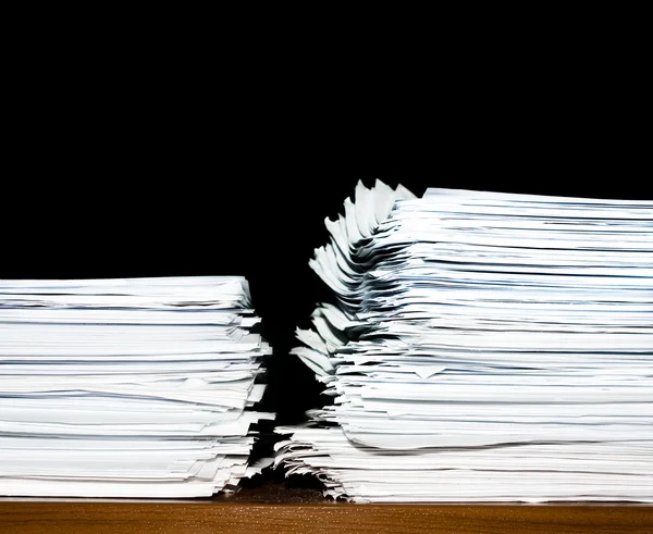 stock image Heap, stack of documents or files, overload of paperwork on black backgroun