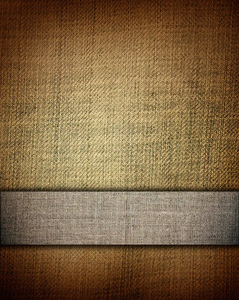 Стареющая коричневая ткань с коричневой полосой в качестве винтажного фона для вставки текста или дизайна — стоковое фото