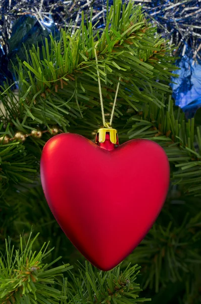 The Christmas-tree decoration in the form of red heart. — Stock Photo, Image