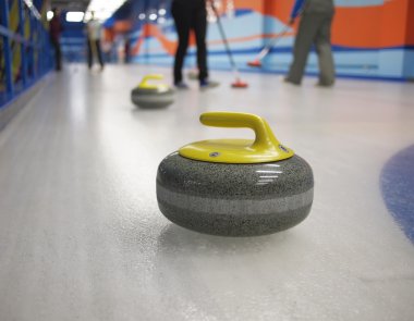 Stones for game in curling on ice. clipart