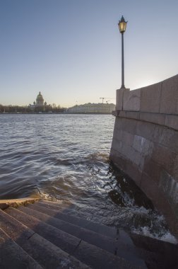 Lantern and steps on quay of the river Neva in St.-Petersburg d clipart