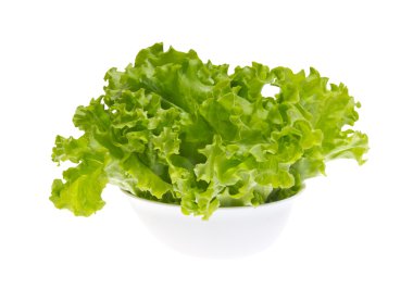 Leaves of green fresh lettuce in the white bowl. clipart