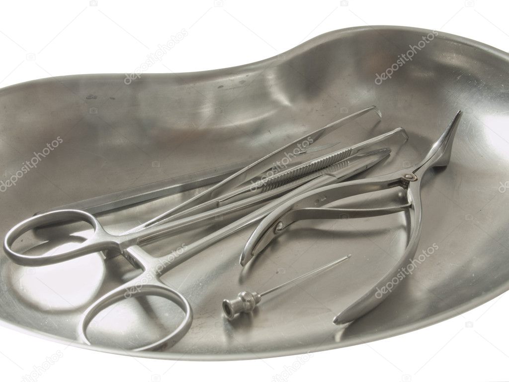 Medical tools in a metal tray.